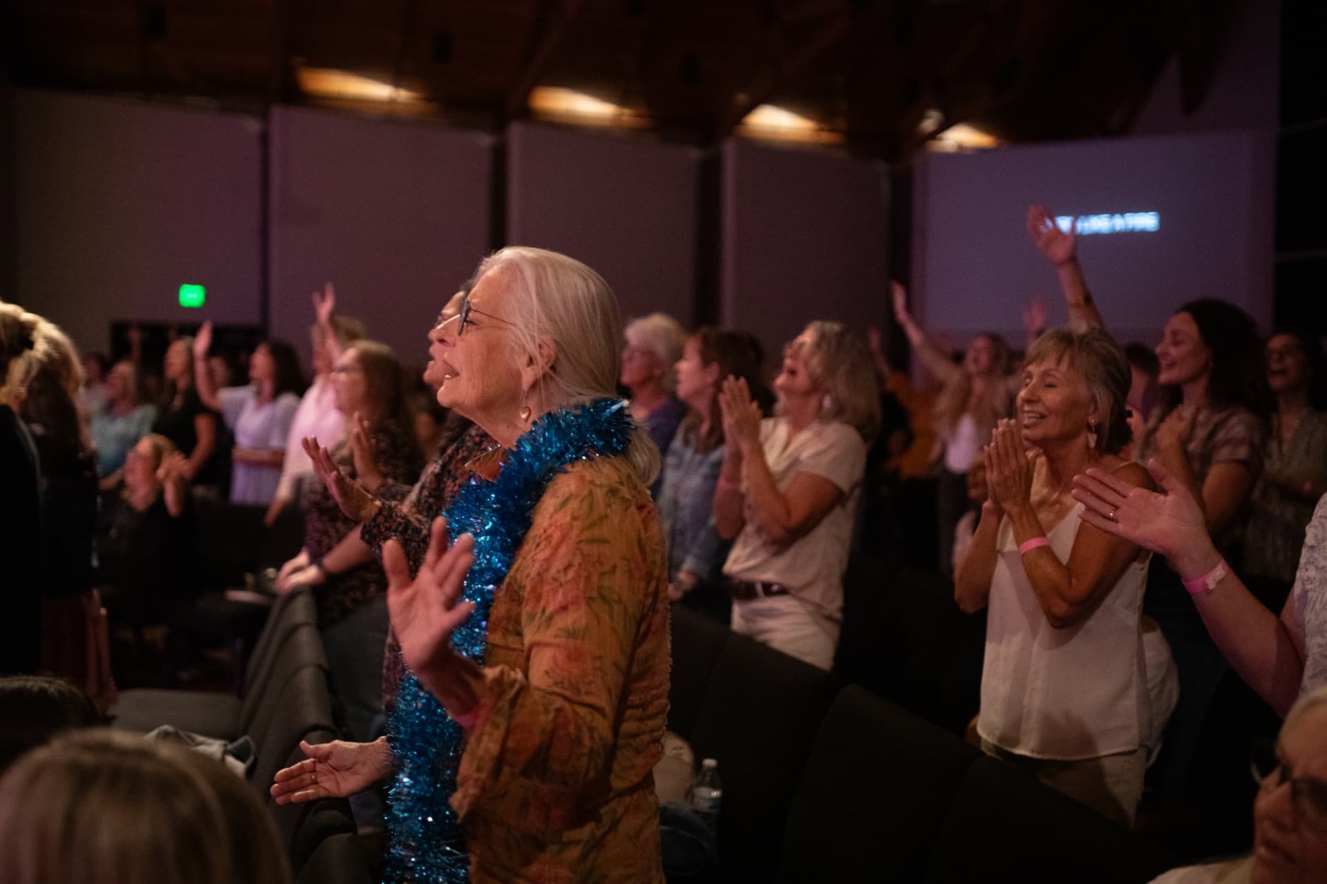 Women worshipping together at BLUSH in the Risen King auditorium